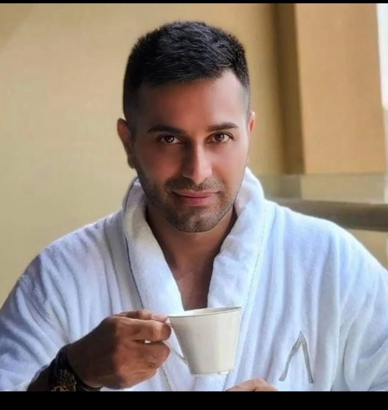 Mah Ghasemi, FitnessBlackBelt coach, relaxing with a cup of tea on a rest day