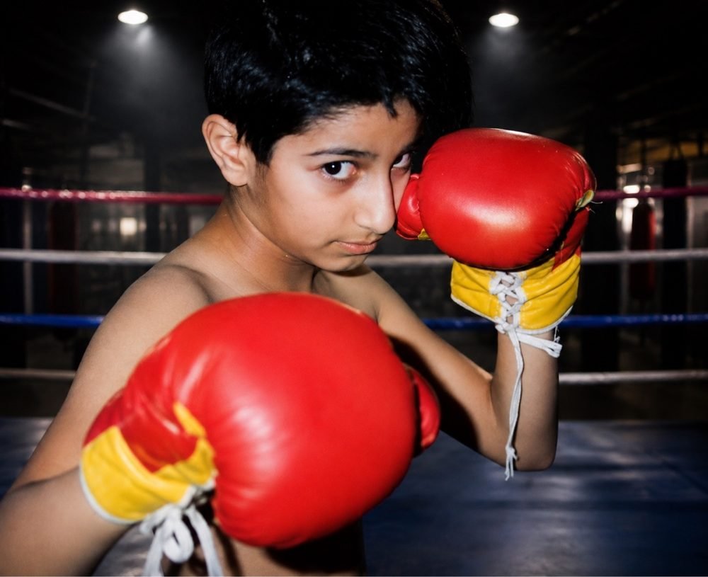 Young Mah Ghasemi in the ring, gloves up