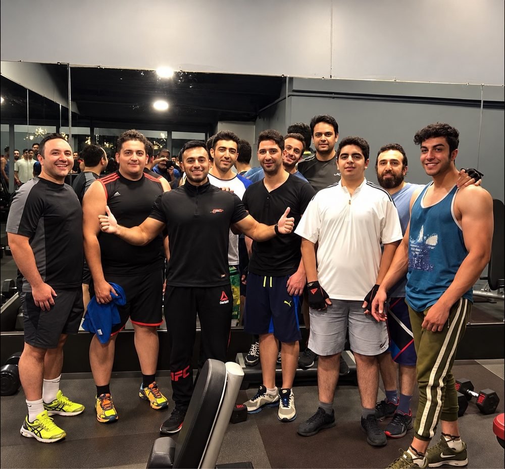 Mah Ghasemi with his clients after a training session