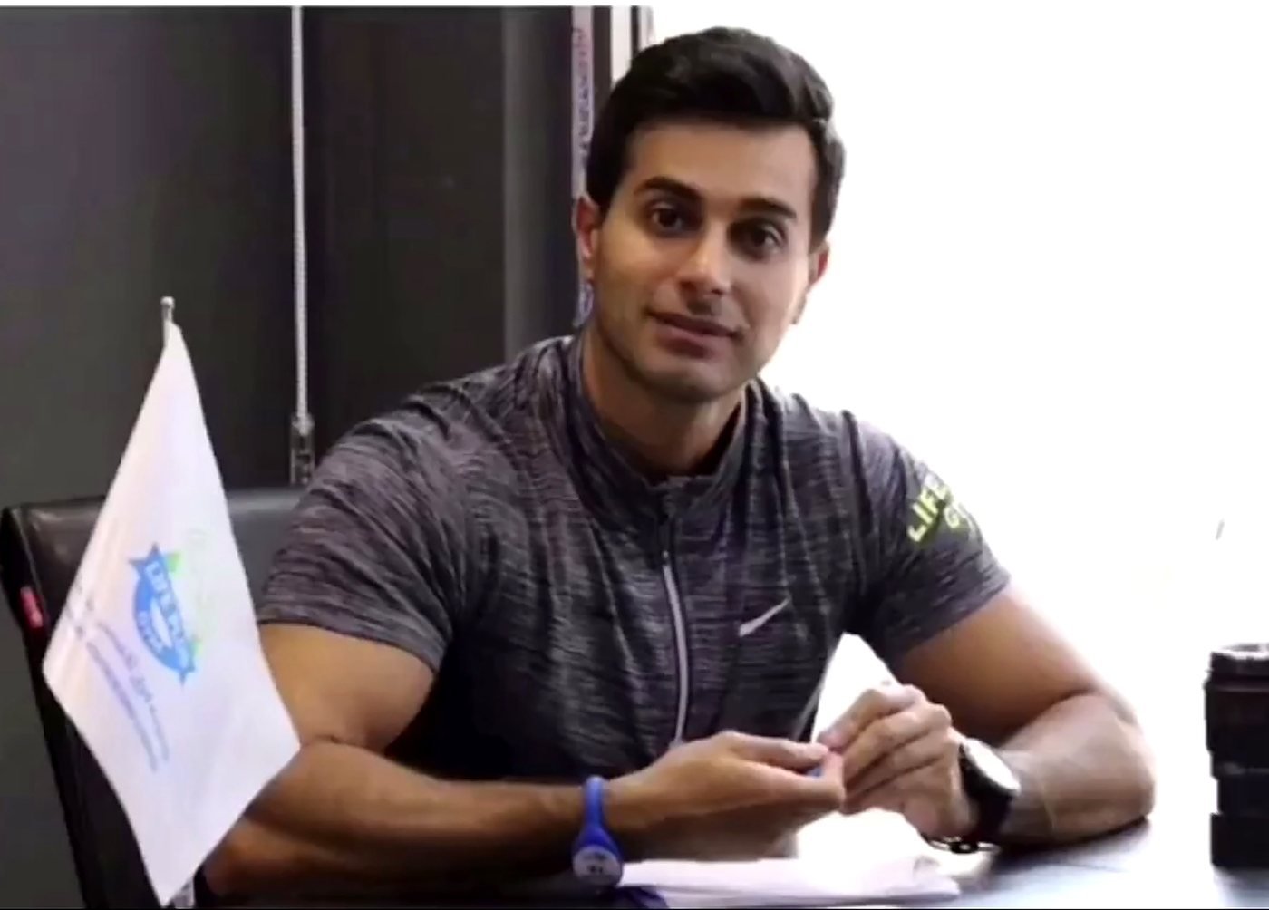 Mah Ghasemi at his desk, building a client's training plan